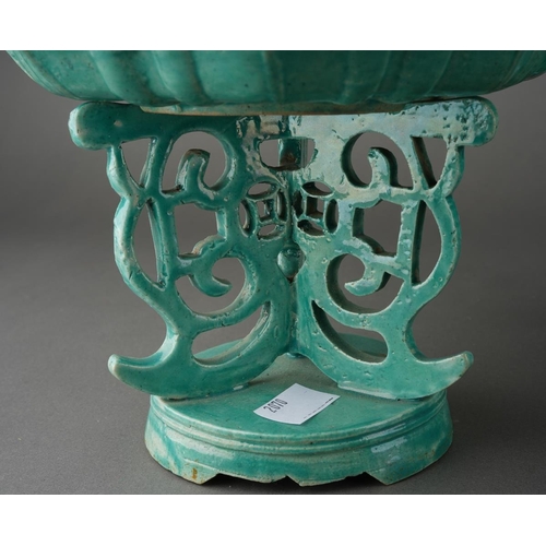 128 - A matched garniture of Chinese turquoise glazed dishes on stands, shaped octagonal moulded dishes ov... 