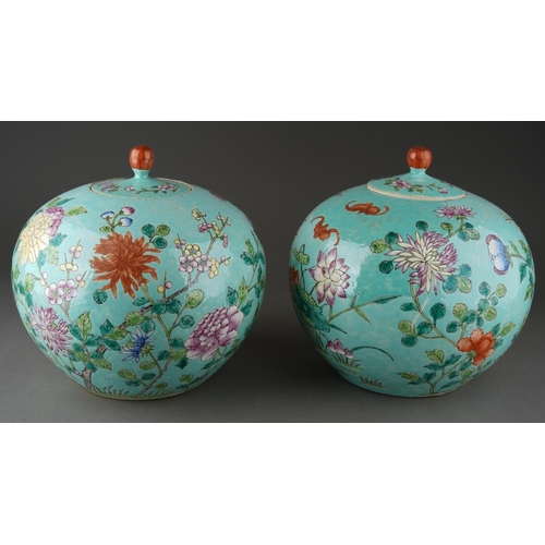 129 - A pair of 20th Century Chinese large globular ginger jars and covers, decorated in the Famille Rose ... 