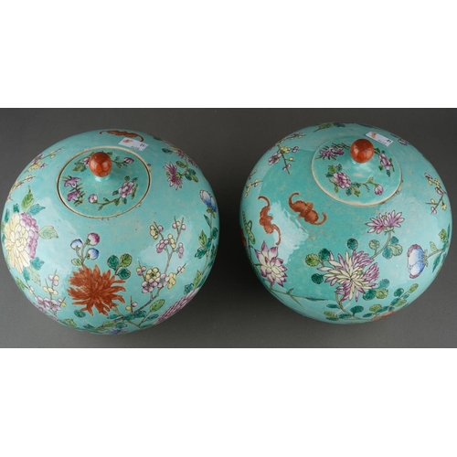 129 - A pair of 20th Century Chinese large globular ginger jars and covers, decorated in the Famille Rose ... 
