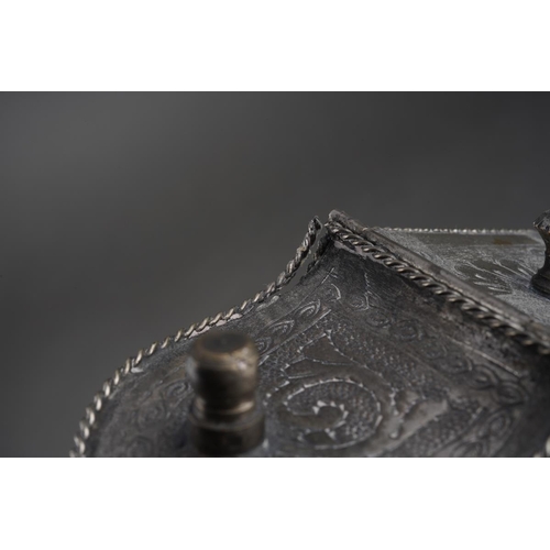 201 - An Asian possibly Cambodian engraved white metal [low grade untested] betel nut box, with ropetwist ... 