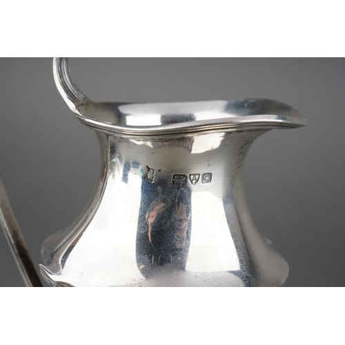 203 - An Edwardian Neo-Classical silver urn shaped cream jug with reeded handle on raised foot, hallmarked... 