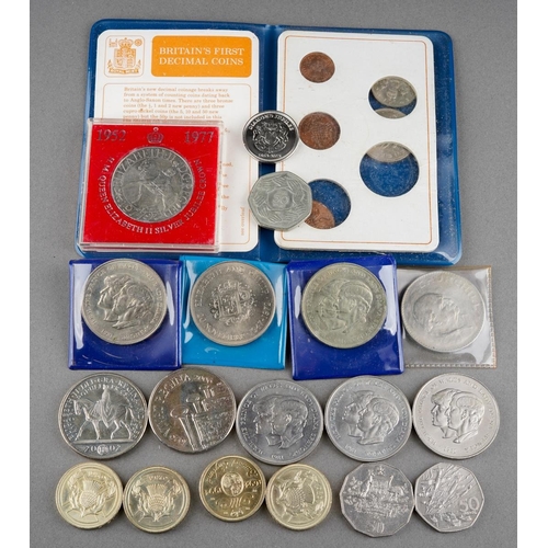 323 - A collection of coins to include Britain's first decimal coin set, crowns, Churchill, commemorative ... 