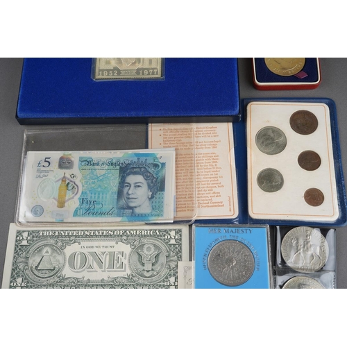 332 - A collection of coins to include a 1977 silver jubilee 1D silver stamp ingot set, a 1981 Royal Weddi... 