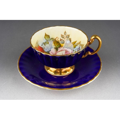 An Aynsley Cabbage Rose 1033 pattern fluted tea cup and saucer, the cup ...