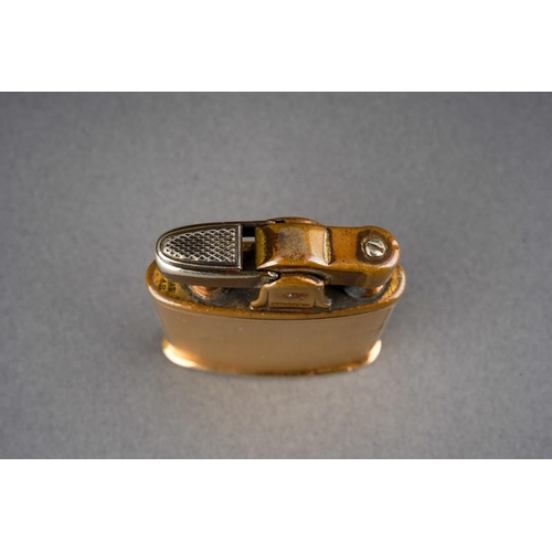 A vintage Ronson Dureum 9ct gold cased engine turned with central ...