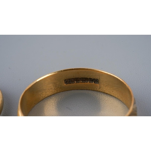 Two 9ct gold rings. To include a 9ct gold band ring and a 9ct gold ruby ...