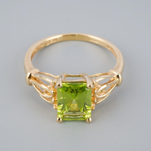A 9ct gold peridot single stone ring. Hallmarked 9ct gold, sponsors ...