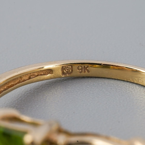 A 9ct gold peridot single stone ring. Hallmarked 9ct gold, sponsors ...