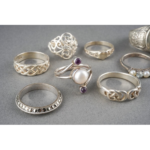 A collection of silver and white metal rings. To include a silver ...
