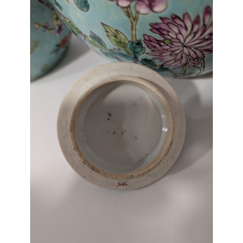 129 - A pair of 20th Century Chinese large globular ginger jars and covers, decorated in the Famille Rose ... 