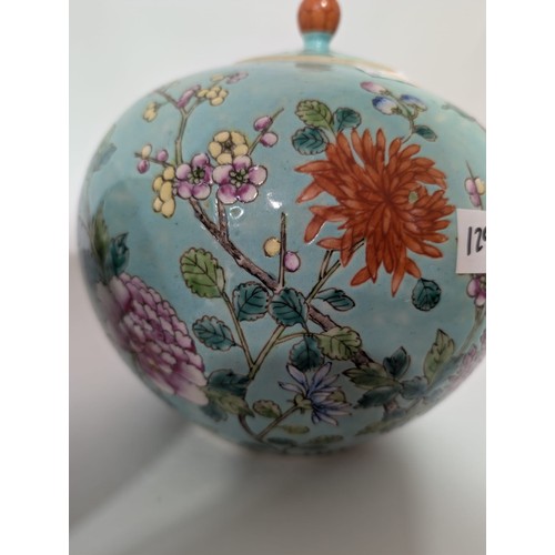 129 - A pair of 20th Century Chinese large globular ginger jars and covers, decorated in the Famille Rose ... 