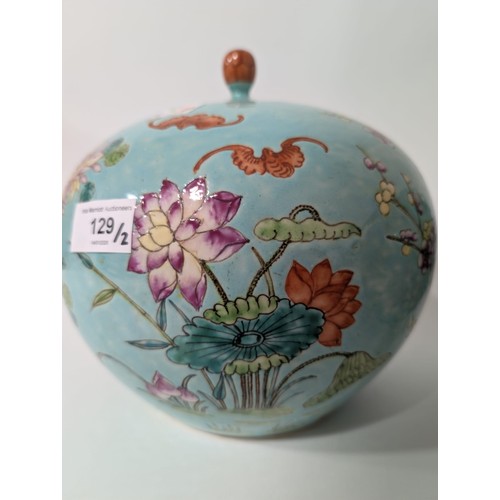 129 - A pair of 20th Century Chinese large globular ginger jars and covers, decorated in the Famille Rose ... 