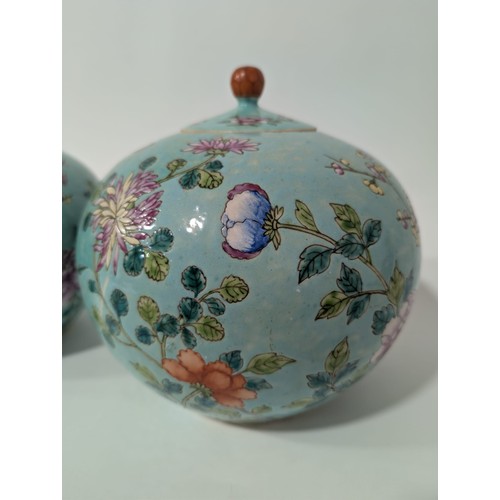 129 - A pair of 20th Century Chinese large globular ginger jars and covers, decorated in the Famille Rose ... 