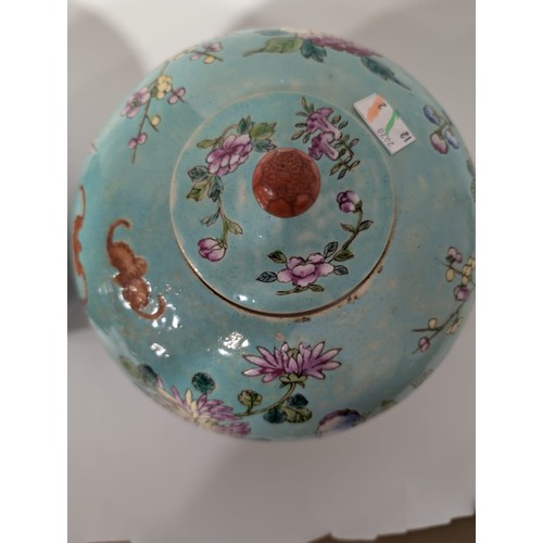 129 - A pair of 20th Century Chinese large globular ginger jars and covers, decorated in the Famille Rose ... 