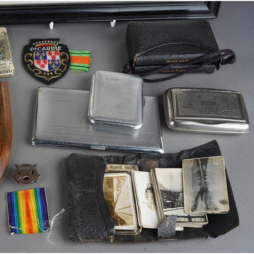 2 - A collection of WWI and WWII militaria, comprising a set of four medals on a bar, the WWI medals nam... 
