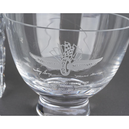 44 - Four pieces of Tiffany & Co glassware, comprising a star shaped paperweight, two flattened points to... 