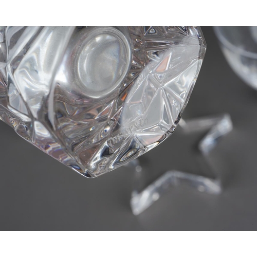 44 - Four pieces of Tiffany & Co glassware, comprising a star shaped paperweight, two flattened points to... 