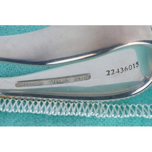 59 - Two Tiffany & Co silver spoons, comprising a boxed baby's feeding spoon, stamped 