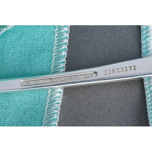 59 - Two Tiffany & Co silver spoons, comprising a boxed baby's feeding spoon, stamped 