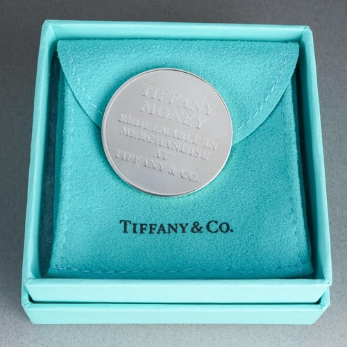 63 - A boxed Tiffany & Co Twenty Five Dollars token, the reverse stamped 