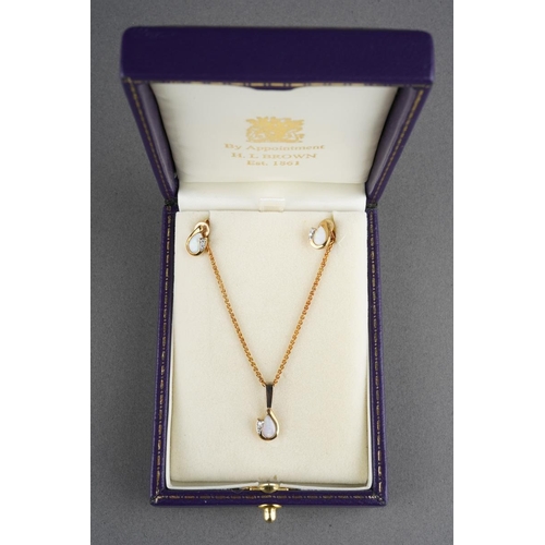 76 - An opal and diamond pendant and earring set, pendant with long 9ct gold chain. The pendant set with ... 