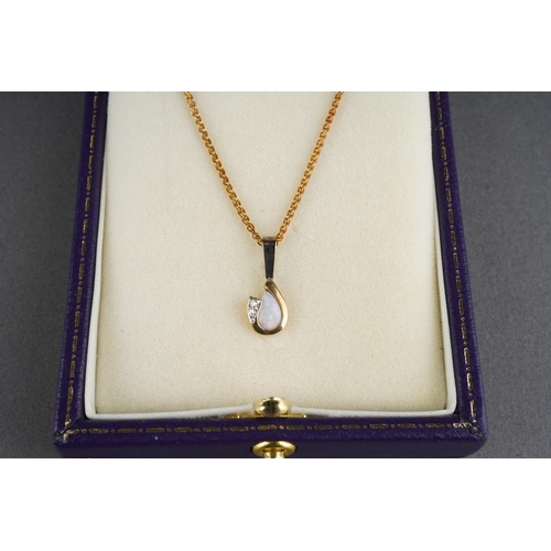 76 - An opal and diamond pendant and earring set, pendant with long 9ct gold chain. The pendant set with ... 
