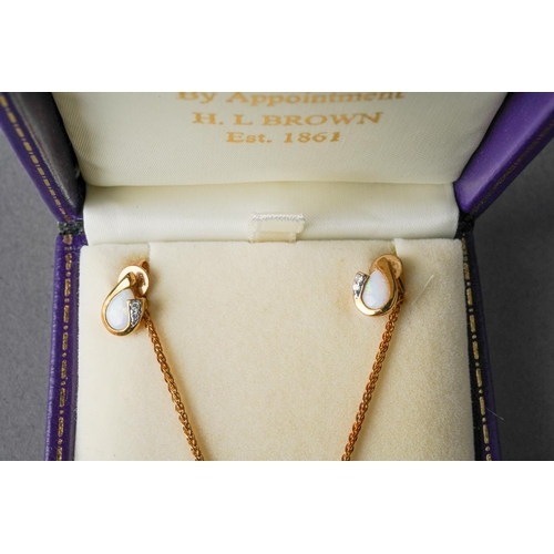 76 - An opal and diamond pendant and earring set, pendant with long 9ct gold chain. The pendant set with ... 