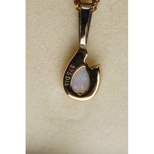 76 - An opal and diamond pendant and earring set, pendant with long 9ct gold chain. The pendant set with ... 