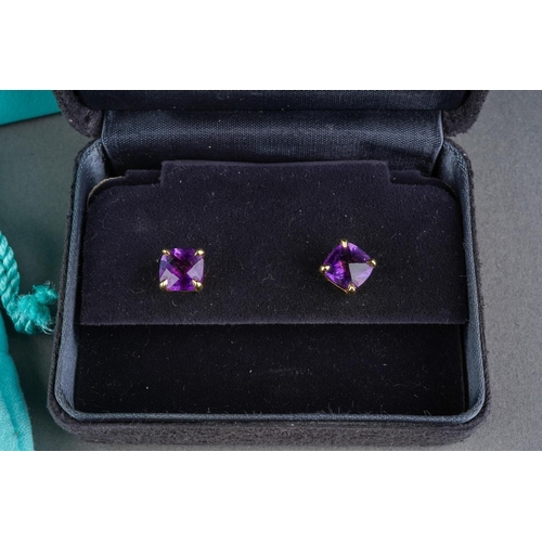 78 - TIFFANY & CO. a pair of amethyst 'sparkler' single stone ear studs. Each ear stud set with an amethy... 