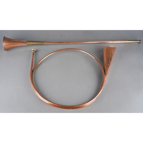 430 - Two copper and brass coaching horns one of scrolled circulour form the other straight (74 cm long ap... 