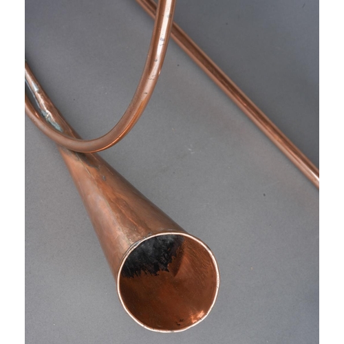 430 - Two copper and brass coaching horns one of scrolled circulour form the other straight (74 cm long ap... 