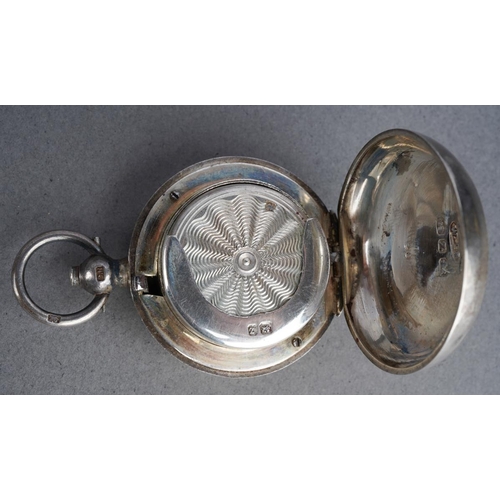 455 - A late Victorian silver sovereign case of circular form, engine turned decoration with vacant scroll... 
