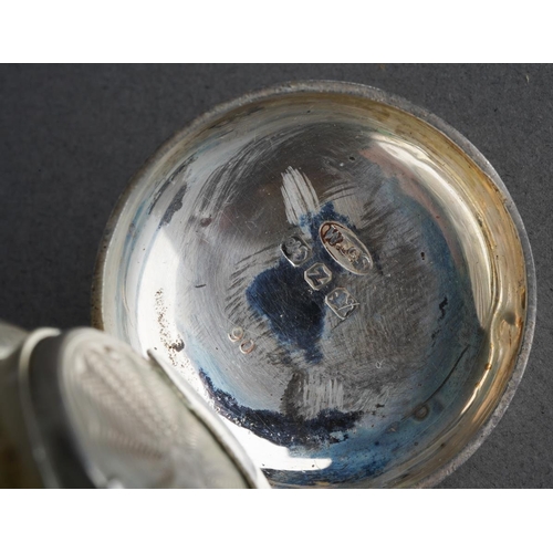 455 - A late Victorian silver sovereign case of circular form, engine turned decoration with vacant scroll... 