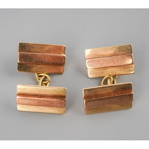 474 - A pair of Art Deco rose and yellow gold cufflinks. Stamped 9ct to reverse of each cufflink face, app... 