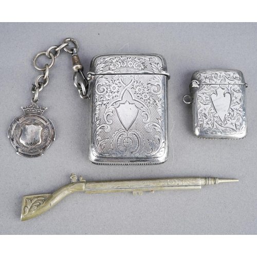 477 - A late Victorian silver vesta case of rectangular form, with engraved decoration, London 1900, with ... 