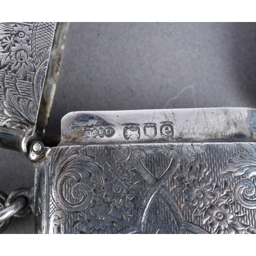 477 - A late Victorian silver vesta case of rectangular form, with engraved decoration, London 1900, with ... 