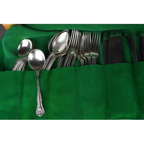 494 - A modern Viners Gerald Benney part canteen of stainless steel cutlery, boxed silver plated serving s... 