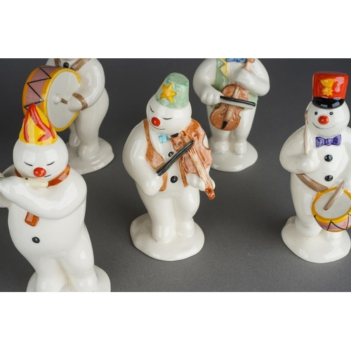 524 - Eight Royal Doulton Snowman band figures from The Snowman Gift Collection including Pianist, Drummer... 