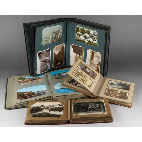 698 - Collection of 4 albums of various early 20th century and later post cards and photographic post card... 