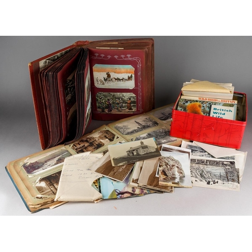 699 - A tin containing various post cards and albums of tea cards and two albums of early 20th century and... 