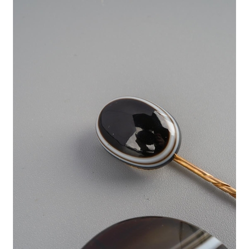 728 - An antique gold sardonyx stickpin, together with a base metal agate brooch. Approx length stickpin 6... 