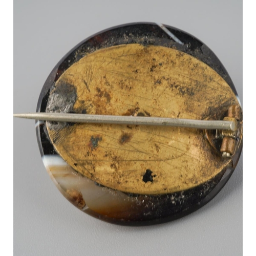 728 - An antique gold sardonyx stickpin, together with a base metal agate brooch. Approx length stickpin 6... 