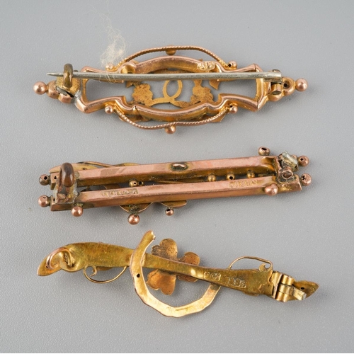 734 - A collection of three 9ct gold antique brooches. Each brooch with marks indicating 9ct gold, some br... 