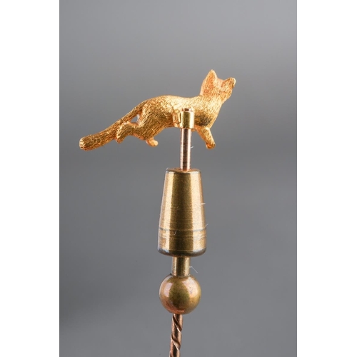 741 - A late 19th century 15ct gold fox stickpin. The fox stamped 15ct, with screw thread detail, to the s... 
