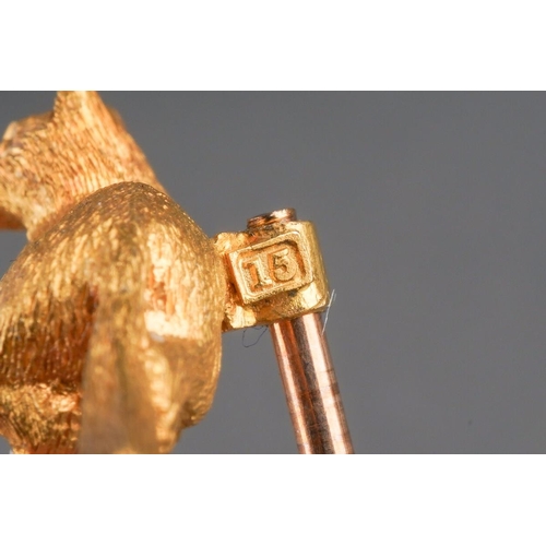 741 - A late 19th century 15ct gold fox stickpin. The fox stamped 15ct, with screw thread detail, to the s... 