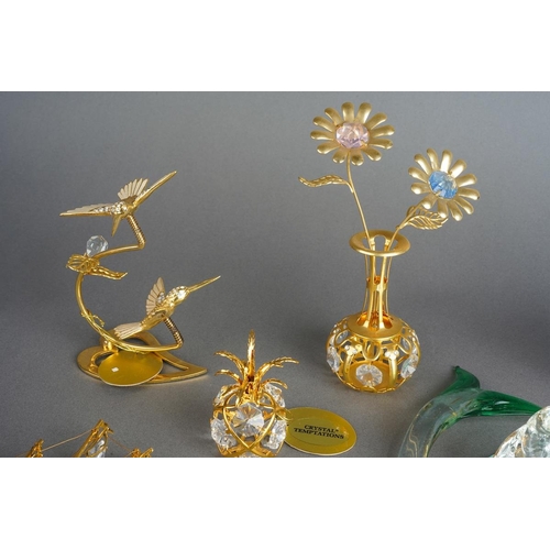 1000 - Eight Crystal Temptations by Swarovski 24k gold plated ornaments including vase of flowers, birds, p... 