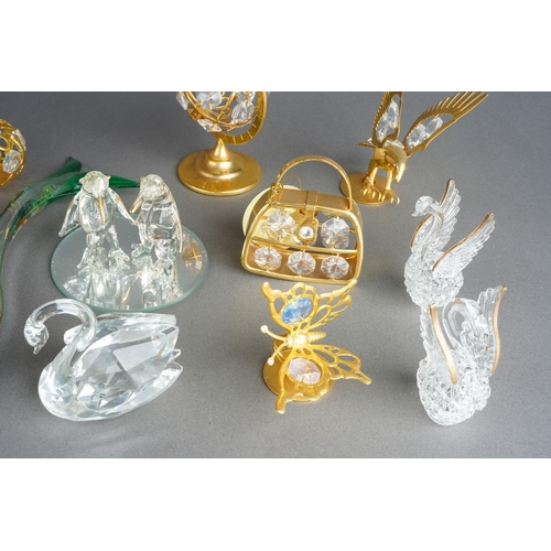 1000 - Eight Crystal Temptations by Swarovski 24k gold plated ornaments including vase of flowers, birds, p... 