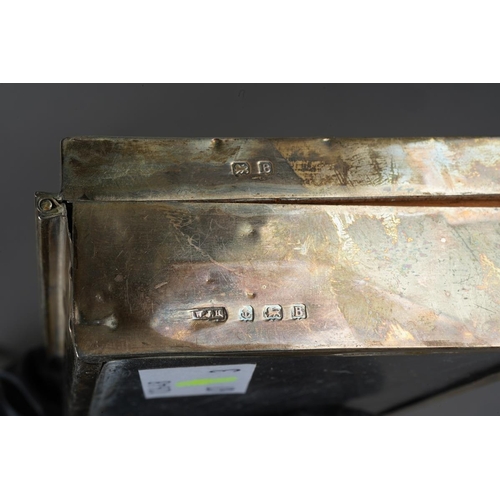 1028 - A pair of later Victorian silver mounted clothes brushes, chased with flowers and shell, hallmarked ... 