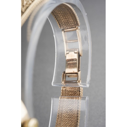 1047 - A 9ct gold Vintage 1970s Omega wristwatch. The silver tone dial, with black enamel gilt hourly appli... 