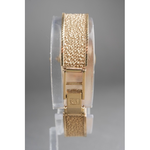 1047 - A 9ct gold Vintage 1970s Omega wristwatch. The silver tone dial, with black enamel gilt hourly appli... 